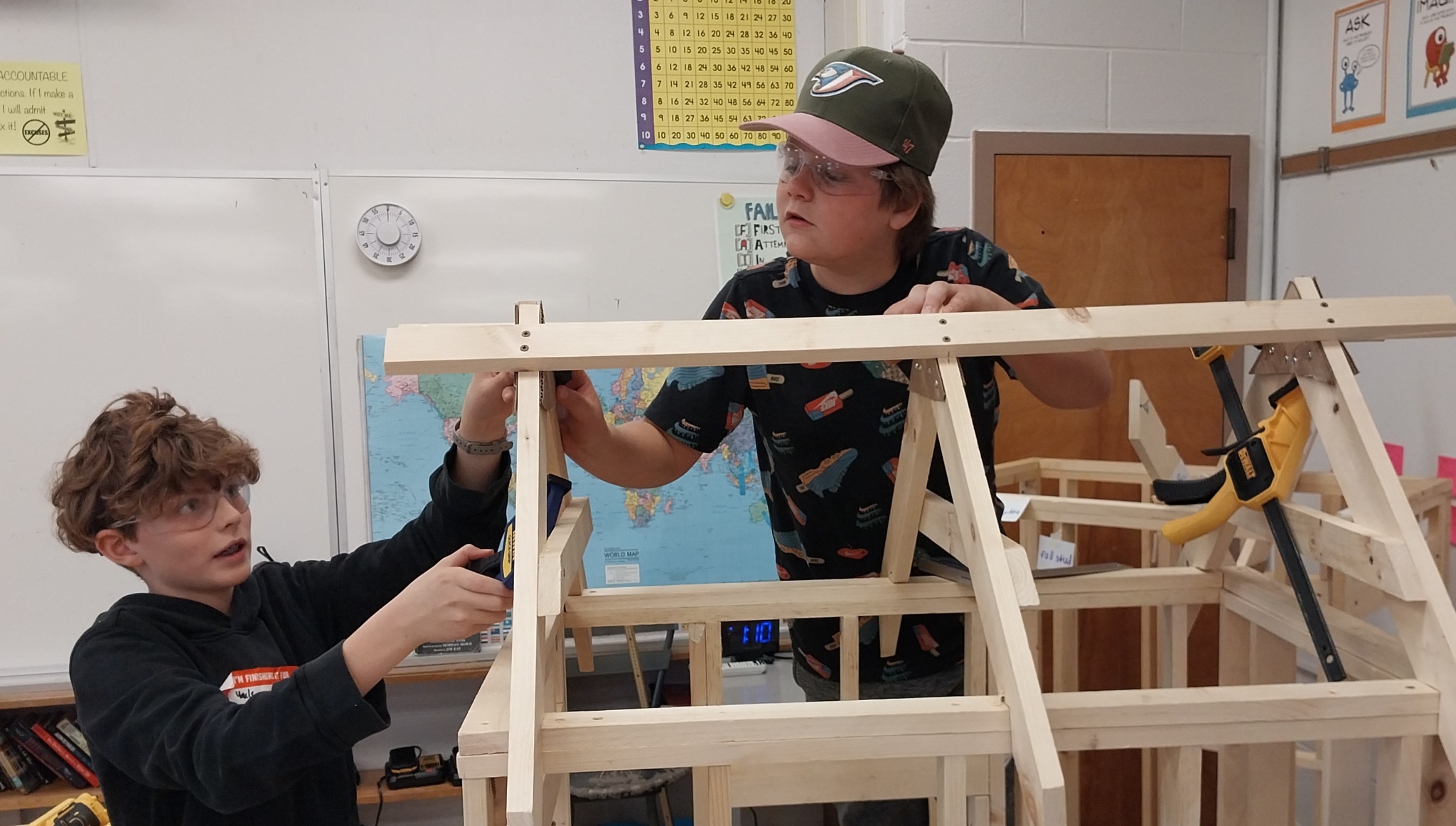 Two Elginburg students work on a carpentry project